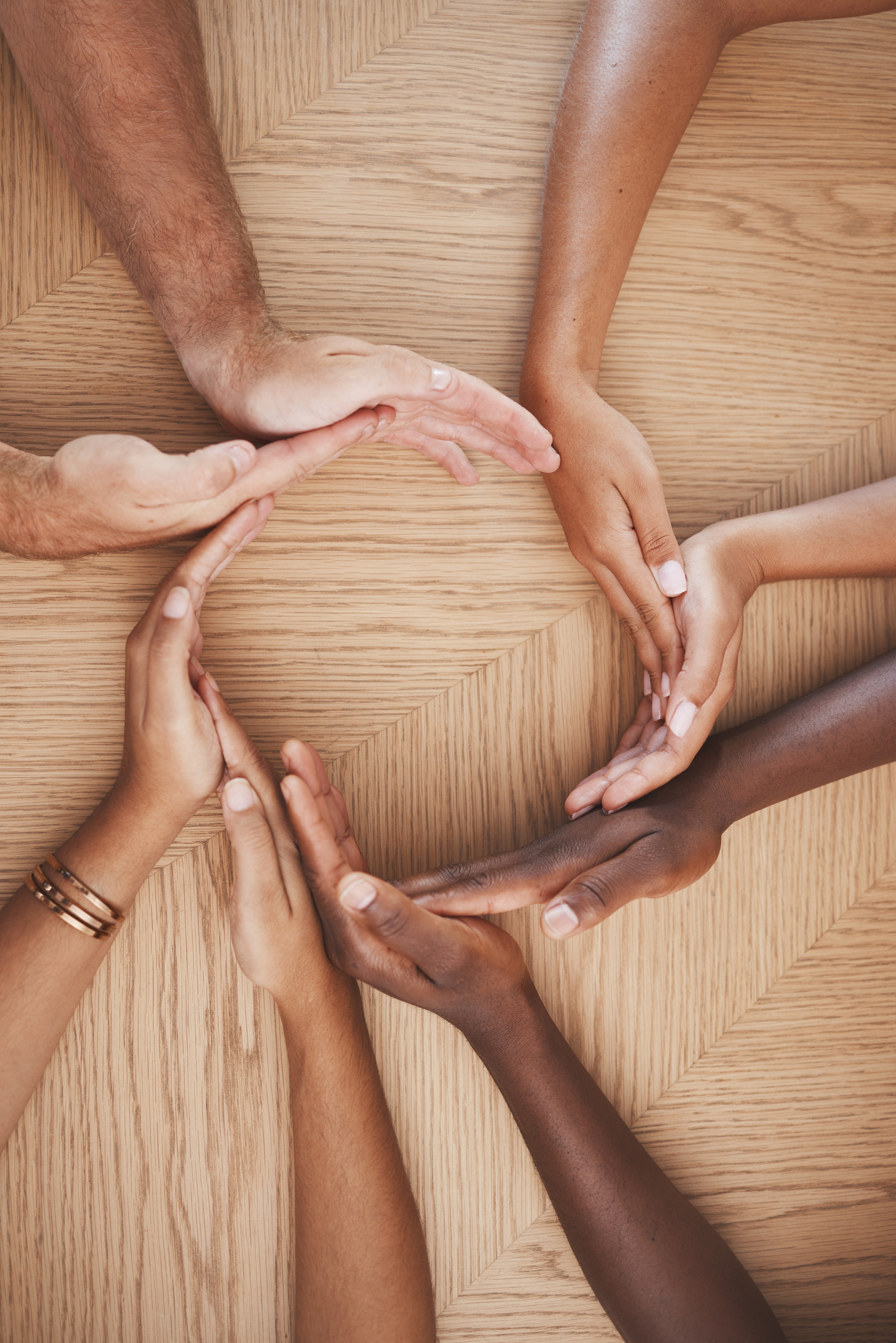 Diversity, Teamwork and Creative Hands in Synergy of Employee Workers Together in Collaboration at Work. Table Group of People Hand in Circle Unity for Agreement, Help and Team for Community