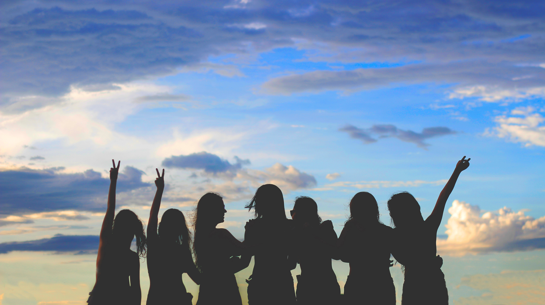 Silhouette Photo Of Women Under Blue Sky